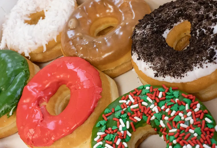 Assorted donuts Assorted frosted donuts on a tray