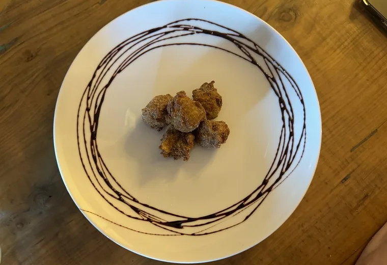 Donut holes Bite-size donut holes on a plate
