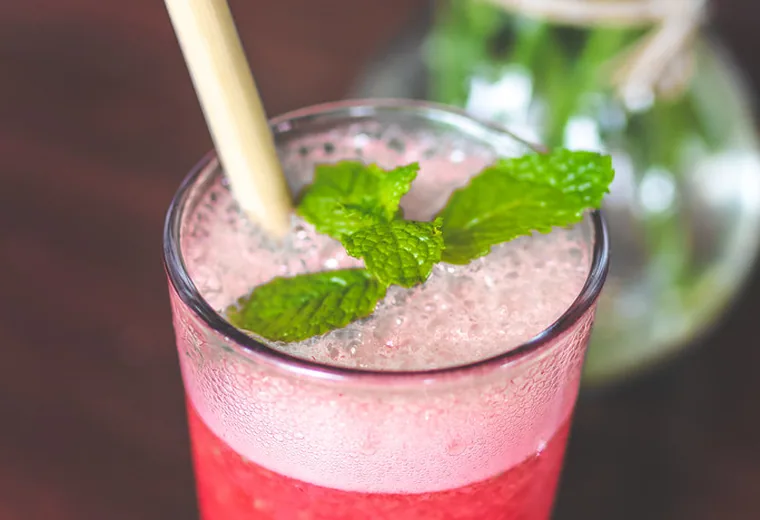 Fruit refresher A pink fruit refresher with mint