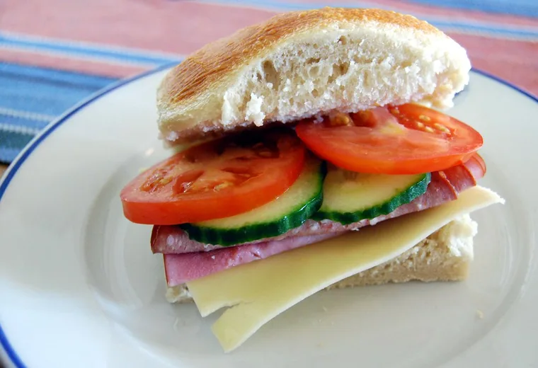 Breakfast sandwich A breakfast bagel sandwich with egg, cheese and tomato